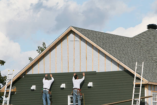 Professional Storm Damage Siding Repair technician working in Southborough, MA